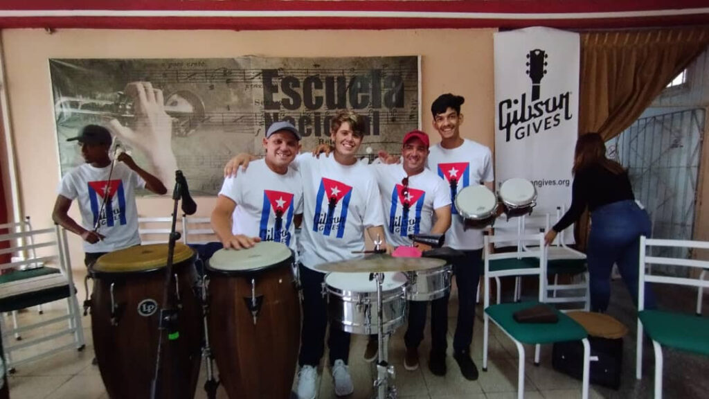 students and staff at the National School of Arts in Cuba attend the Gibson Gives donation event.
