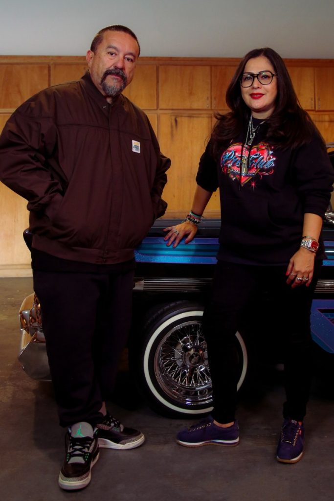 Mister Cartoon (left), artist and creative director, wears the Cascade Jacket ($70). Blanca Gonzalez (right), SVP and General Manager of WSS, wears the Pro Heart Hoody ($65). Both pieces are part of the limited-edition Mister Cartoon x Pro Club capsule collection, available exclusively at WSS stores and shopwss.com.