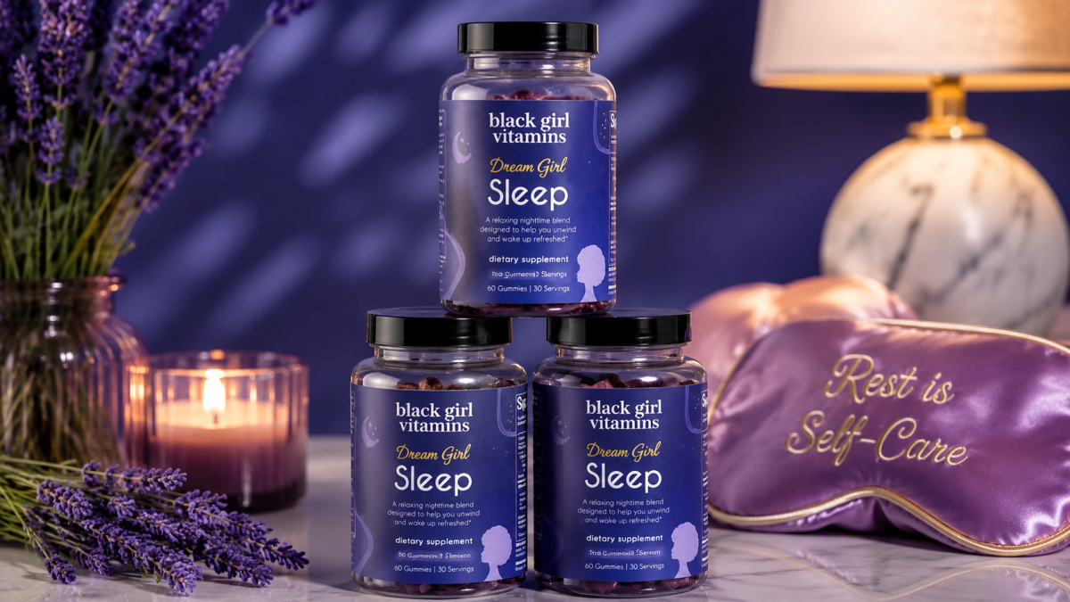 Three bottles of Black Girl Vitamins Dream Girl Sleep Gummies stacked in a pyramid display, showcasing the berry-lavender sleep supplement formulated to support restful sleep and wellness for Black women.
