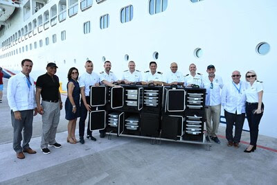 Carnival Cruise Line ship participating in surplus meal donation program in Roatán Honduras