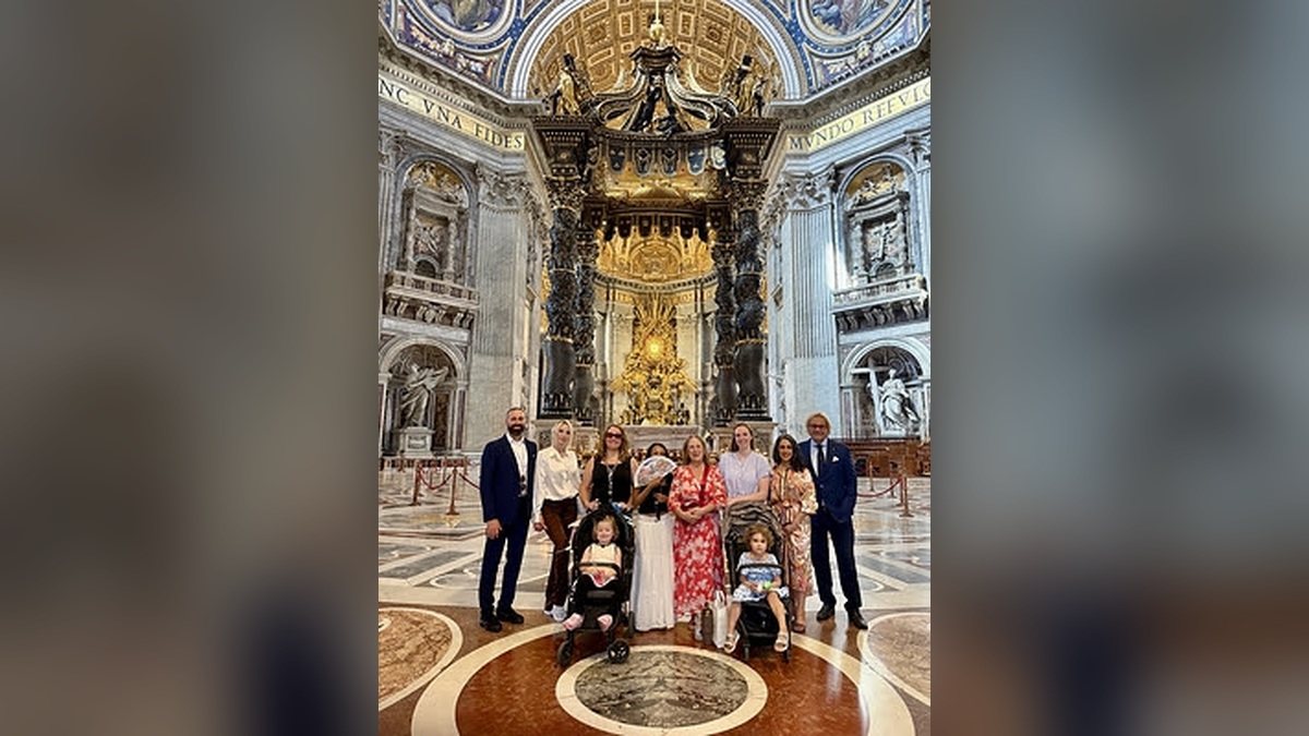 Children and families participating in the Zo's Bravehearts Foundation Rome trip pose together inside St. Peter's Basilica at the Vatican.